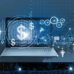 A laptop screen displaying illuminated digital network nodes, financial graphics, and a dollar sign symbol.