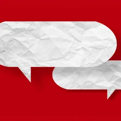 White speech bubble crumpled paper isolated on red background, indicating the debates surrounding the use of AI in Nikon Small World Photography competition.
