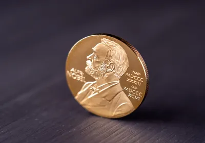 Image of Nobel Prize medal on a table.