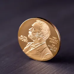 Image of Nobel Prize medal on a table.