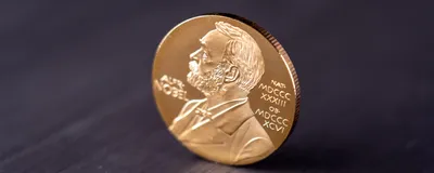 Image of Nobel Prize medal on a table.